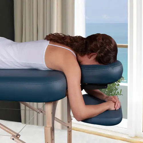 Professional massage table armrest extensions providing added comfort and support for spa treatments and massage therapy.