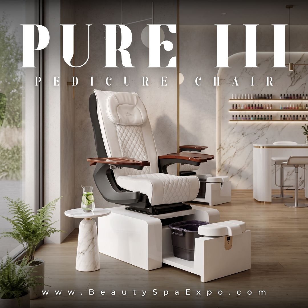Pure III Pedicure Chair in white diamond-quilted upholstery with wooden manicure trays and pedicure basin base.
