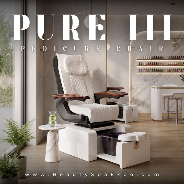 Pure III Pedicure Chair in white diamond-quilted upholstery with wooden manicure trays and pedicure basin base.